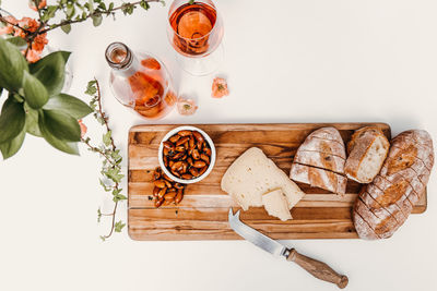 Snack board with rosé styled on white