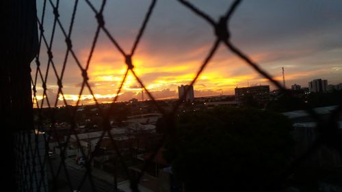 Cityscape against sky during sunset