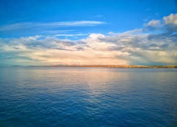 Scenic view of sea against sky at sunset