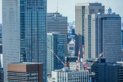 Modern buildings in city against sky