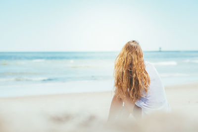 Blond girl on the beach