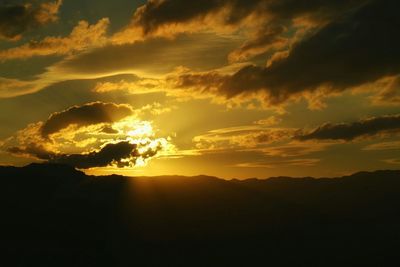 Scenic view of mountains against sky during sunset