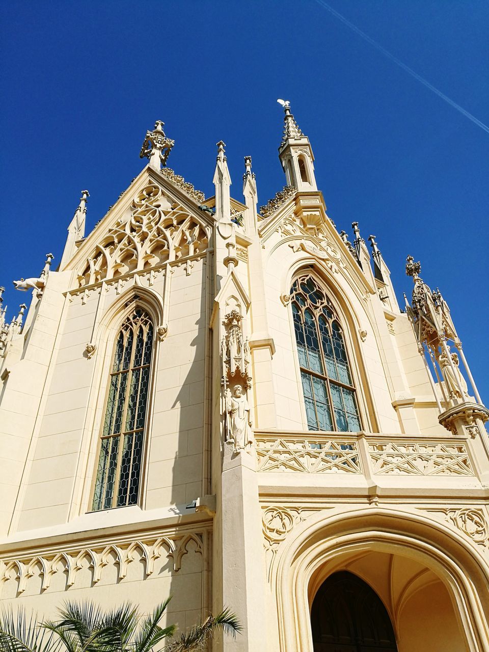 architecture, low angle view, outdoors, religion, day, no people, blue, spirituality, built structure, building exterior, sky