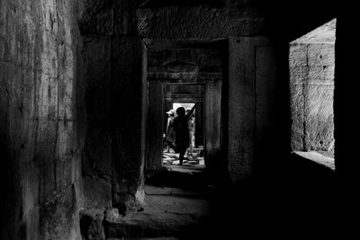 People walking in corridor of building