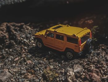 Close-up of toy car on rock