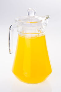 Close-up of drink in glass jar on white background