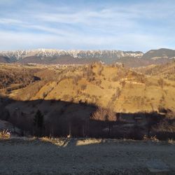 Scenic view of landscape against sky during winter