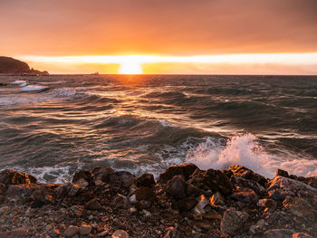 Scenic view of sea against sky during sunset