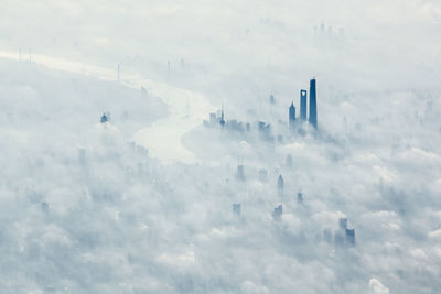 Buildings amidst cloudscape in city