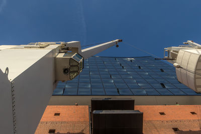 Low angle view of telephone pole against sky