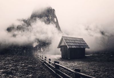 Built structure on land against sky