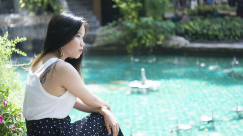 Woman looking at swimming pool