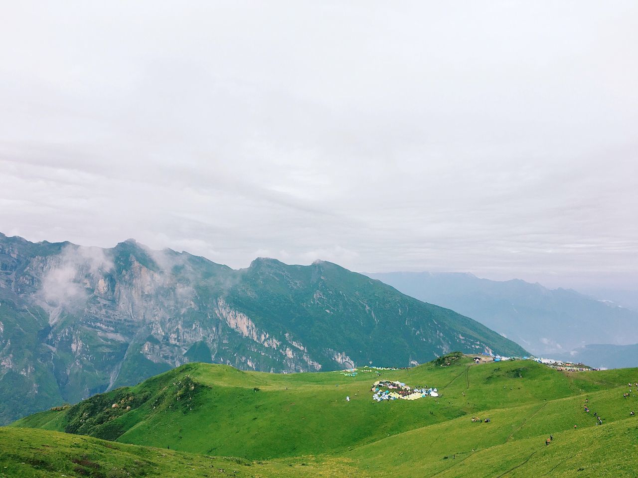 tranquil scene, mountain, beauty in nature, scenics, nature, green color, tranquility, landscape, idyllic, mountain range, no people, grass, field, day, sky, cloud - sky, outdoors, rural scene, agriculture