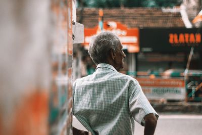 Rear view of man standing outdoors