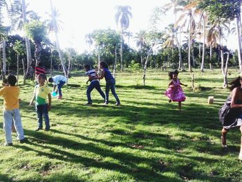 People playing soccer in park