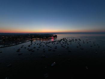 Scenic view of sea against clear sky during sunset