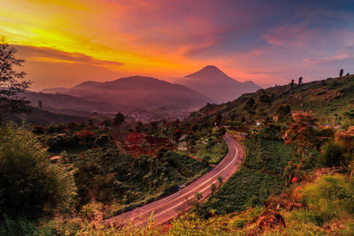 Aerial view of landscape against sky during sunset