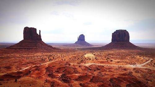 Rock formations on landscape against sky