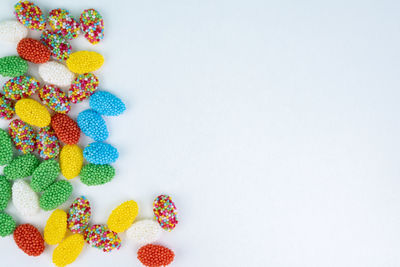 High angle view of multi colored candies on table