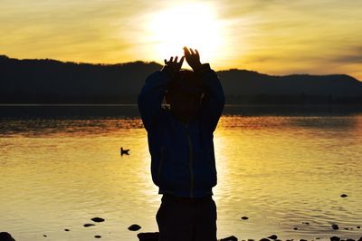 Scenic view of lake at sunset