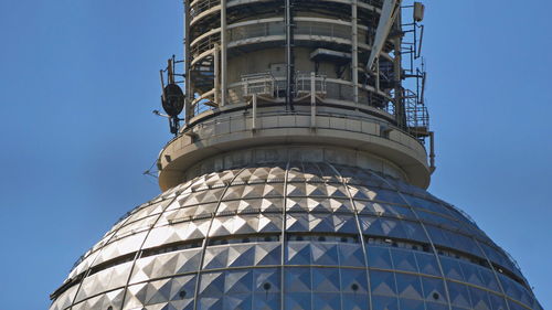 Low angle view of building against clear blue sky