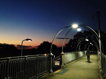 View of illuminated street lights at night