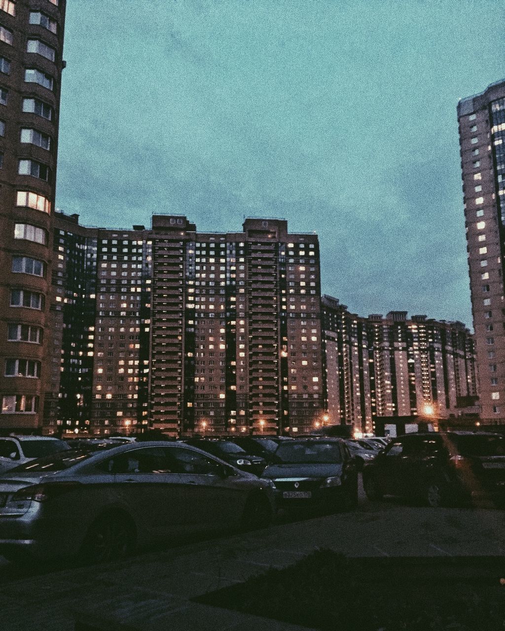 BUILDINGS IN CITY AGAINST SKY DURING SUNSET