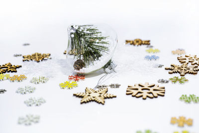 Close-up of christmas decorations over white background