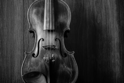 Close-up of violin on wooden table