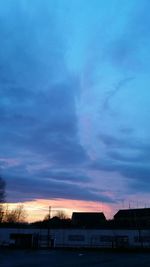 Built structure against sky at sunset