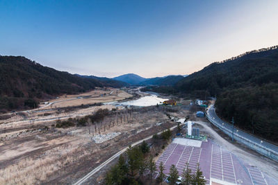 High angle view of road by river against sky