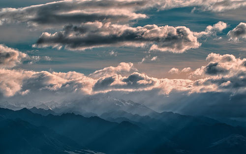 Aerial view of mountains against sky during sunset