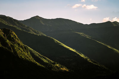 Layers of mountains in sunset light near lake como / lago di como, italy