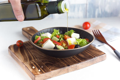 Midsection of person preparing food on table