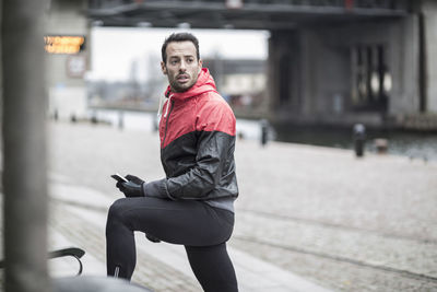 Sporty man looking away outdoors