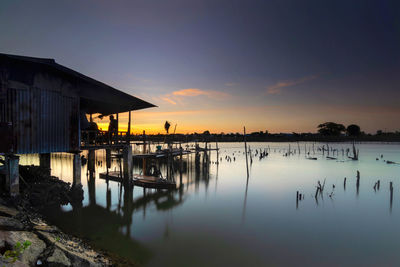 Scenic view of lake against sky during sunset