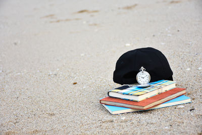 High angle view of books on sand