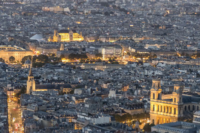 Aerial view of paris at dusk with the city illuminated