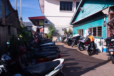 People on street amidst buildings in city