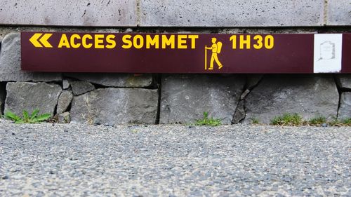 Close-up of information sign in city