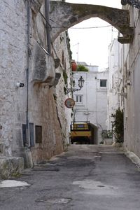 Narrow alley amidst buildings in town