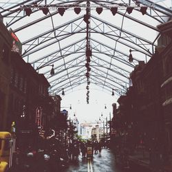 Low angle view of people on escalator