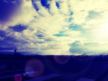 Road against cloudy sky