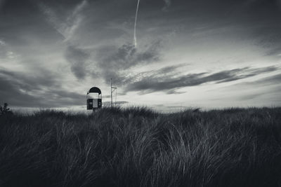 Scenic view of land against sky during sunset