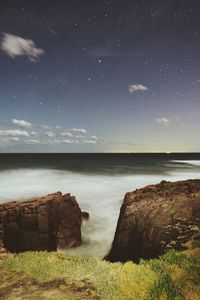 Scenic view of sea against cloudy sky