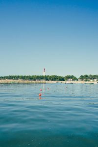 Scenic view of sea against clear blue sky