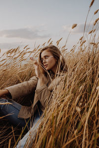 Portrait of young woman in field