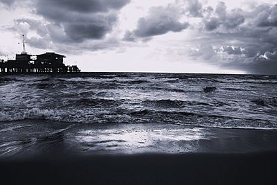 Scenic view of sea against cloudy sky