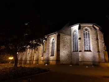 Low angle view of illuminated building at night