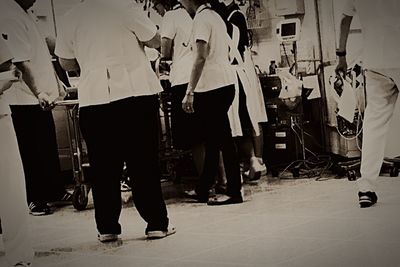 Low section of man with arms raised